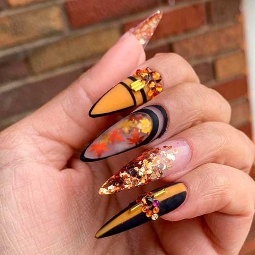 Cute Fall Nails 2021 Consists of Fall Leaves, Glitter, Black and Yellow Almond Nails