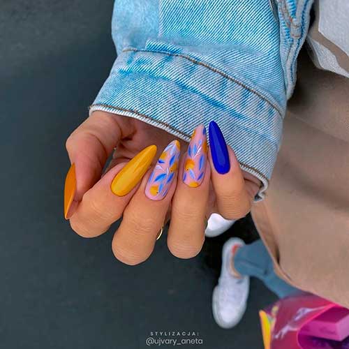 Cute almond shaped autumn shiny burnt yellow, accent bold royal blue, and two accent nails 2020 with design - yellow nail designs