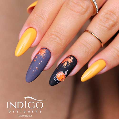 Cute almond shaped autumn shiny yellow nails 2020 with two accent black and gray nails with design for fall season! Cute almond shaped autumn shiny yellow nails 2020 with two accent black and gray nails with design for fall season - yellow nail designs