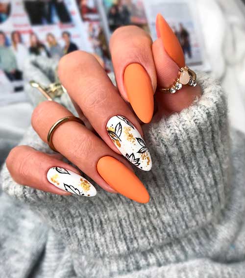 Cute almond fall nails that consists of miss hooligan nail color design with two accent nail leaf nails!