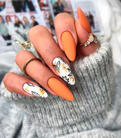 Cute fall almond nails that consists of miss hooligan nail color design with two accent nail leaf nails!