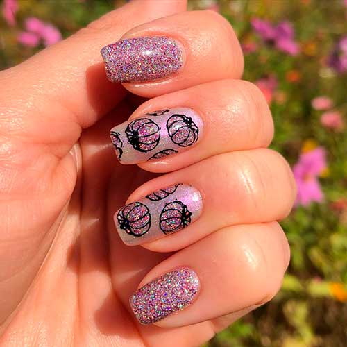 Cute lavender pumpkin nail art that uses glitter on pumpkin nails for Halloween!