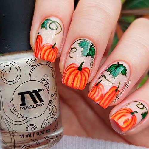Cute pumpkin nails 2020 design with orange pumpkins on nail tips for Halloween