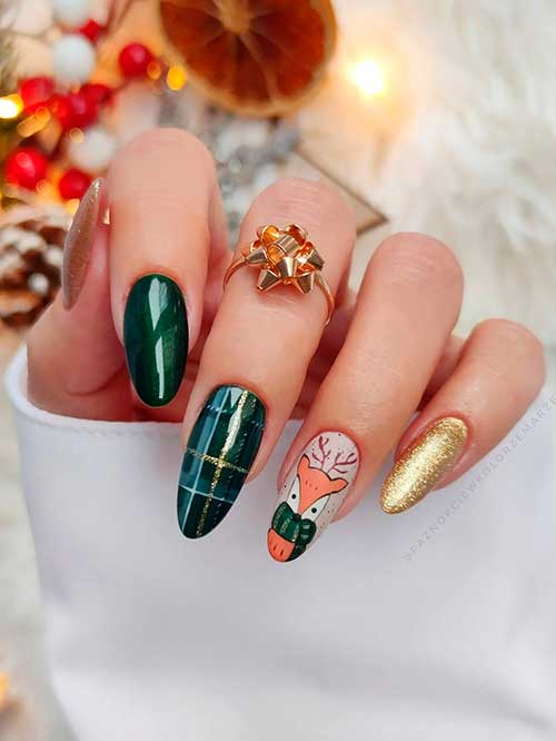 Cute Christmas dark green nails with gold glitter and reindeer accent nails