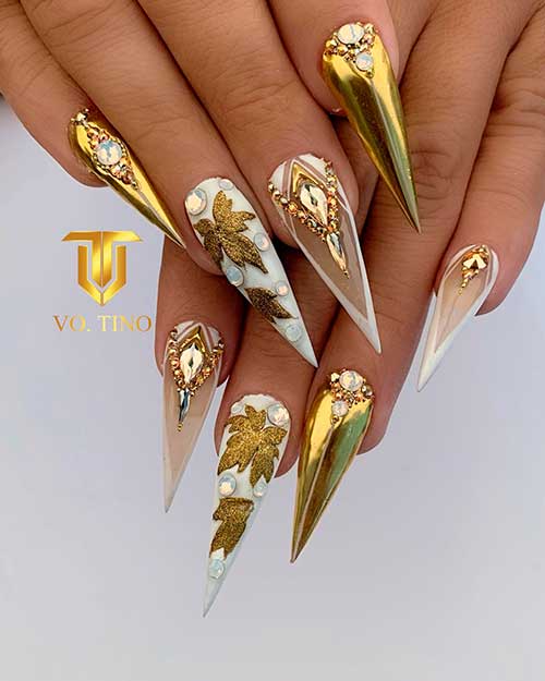 Golden fall chrome nails 2020 stiletto shaped with golden leaves on accent nail design for fall 2020