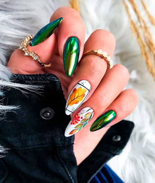 Ivy fall chrome nails 2020 almond shaped with two accent leaf nails with white base color for fall 2020