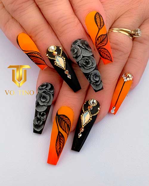 Ombre Matte Orange Nails 2020 with black leaves, accent black nail with gold beads, and accent gray floral nail!