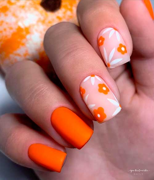Short matte orange nails design with two accent floral nails for autumn 2020!