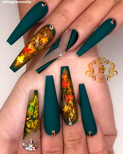 Stunning coffin shaped emerald green nails 2020 with autumn leaves design for autumn/winter 2020 Stunning coffin shaped emerald green nails 2020 with autumn leaves design for autumn/winter 2020