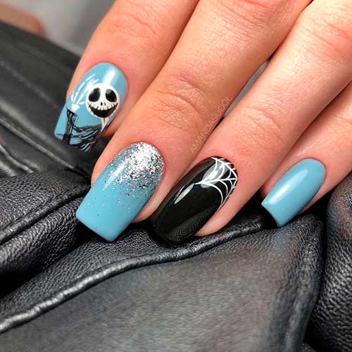 Unique nails consists of shiny blue with black spider nails 2020 for Halloween!