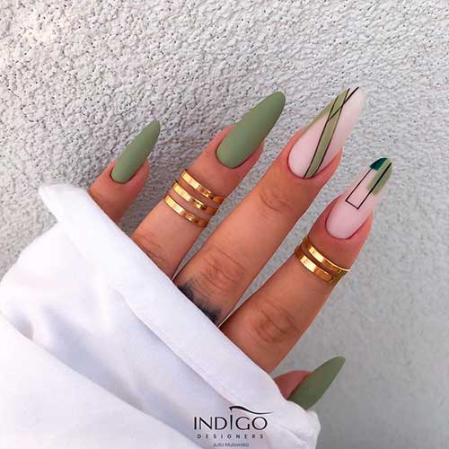 Almond shaped matte olive green nails with two accent nude pink and olive green nails with some black lines!