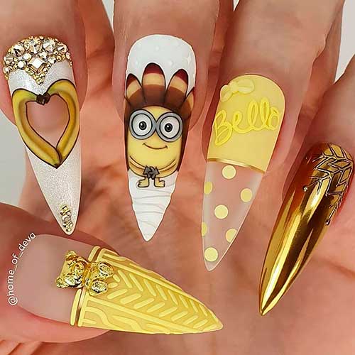 Cute Stiletto Shaped Thanksgiving Nails with banana instead of turkey for thanksgiving feast 2020! Cute Stiletto Shaped Thanksgiving Nails with banana instead of turkey are one of the best Thanksgiving Nail Designs