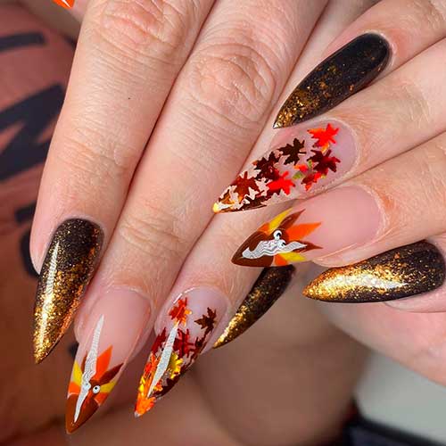 Cute almond glitter fall and thanksgiving nails 2020 with leaves and accent turkey nail for celebration!