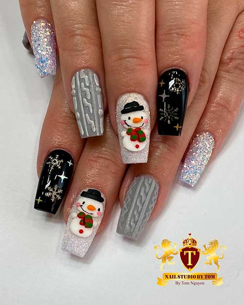 Cute little snowman Christmas nails 2020 with accent glitter nail, accent sweater nail, accent black snowflake nail design!