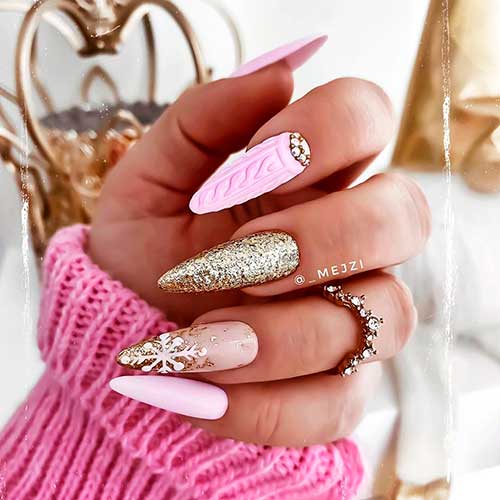 Cute pink almond shaped snowflake nails 2020 design with gold glitter and accent sweater nail!