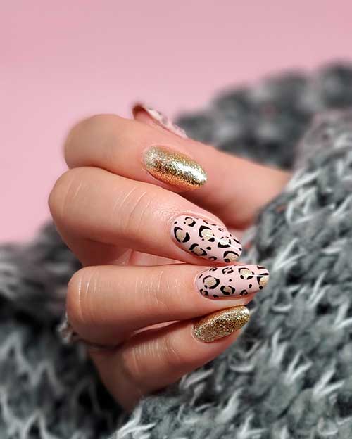Cute pink leopard animal print nails 2020 with gold glitter and two accent gold glitter nails design!