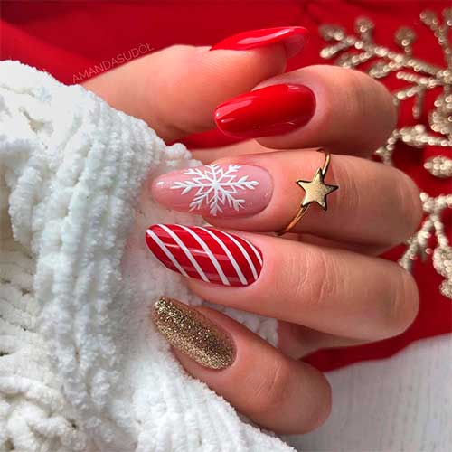 Cute red Christmas nails 2020 almond shaped with three accent white snowflake, candy cane, and gold glitter nails! Cute red Christmas nails 2020 almond shaped with three accent white snowflake, candy cane, and gold glitter nails!