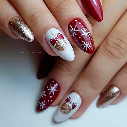 Cute red white snowflake nails 2020 almond shaped with two accent Christmas balls and gold glitter nails design!