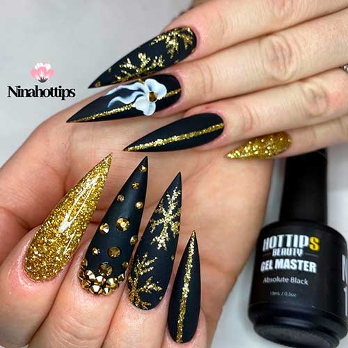 Gold glittery Christmas art on sharp svelte matte black nails 2020 Design!