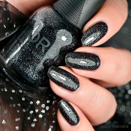 In the Moonlight is a gunmetal glitter Orly nail polish applied on round nails to celebrate Holiday 2020