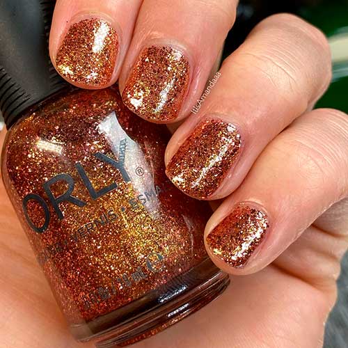 Inexhaustible Charm is a rose gold glitter Orly nail polish applied on short nails to celebrate Holiday 2020 Inexhaustible Charm is a rose gold glitter Orly nail polish applied on short nails to celebrate Holiday 2020