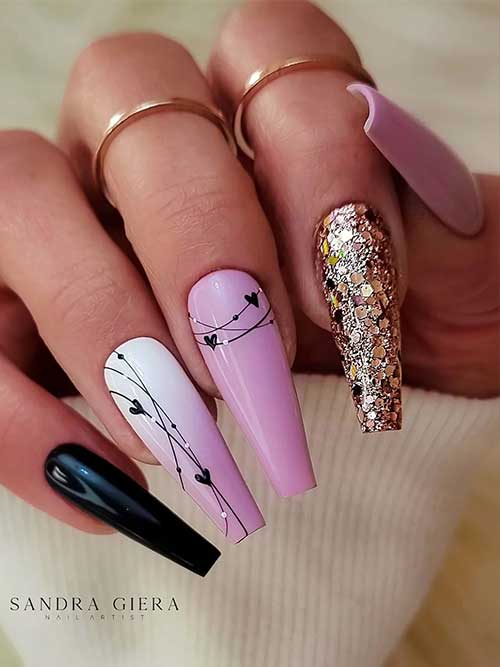 Light Purple Coffin Nails 2023 with Gold Glitter, Black Hearts, and a Black Accent Nail