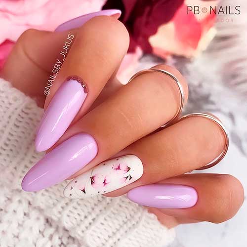 Long almond light purple nails with accent floral nail art design!