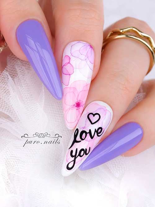 Long almond-shaped Purple Valentines Nails 2023 with Pink Flowers and “love you” words