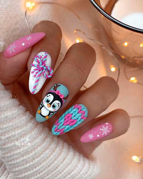 Pastel Christmas penguin nails almond shaped for celebration