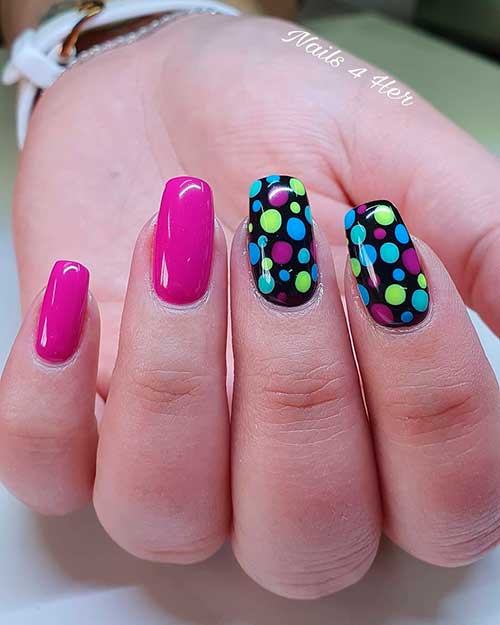 Pink and multi-color polka dot nails 2020 design Pink and multi-color polka dot nails over two accent black nails
