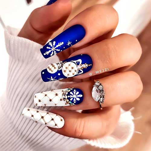 Stunning velvet blue cobalt colored coffin nails with white snowflakes and two accent quilted white nails for Christmas 2020!