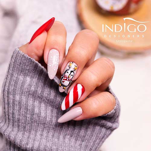 Sweet candy cane penguin nails art design for Christmas celebration!