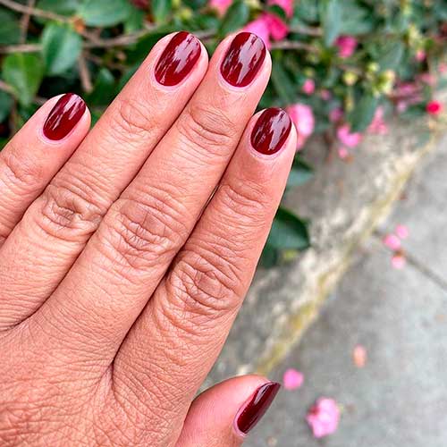 Cute short nails done with OBSESSED Dark Ruby Red Nail Polish by olive & June!
