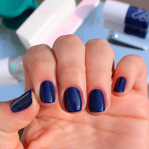 Cute short nails done with OMG Deep Navy Blue Nail Polish by olive & June!
