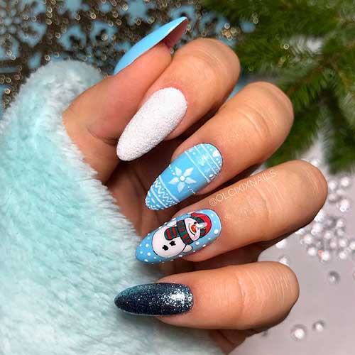 Light blue Christmas nails 2020 design with three accent white sugar glitter, blue silver glitter, and snowman nails!