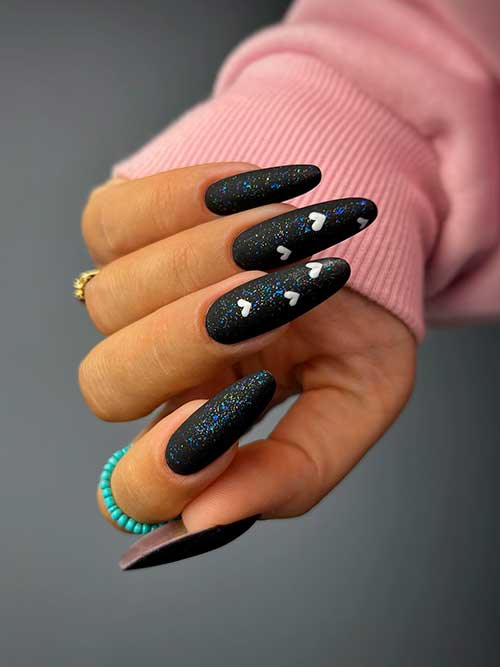 Glitter Black Valentine’s Nails Long almond glitter black valentine’s nails 2023 with white hearts