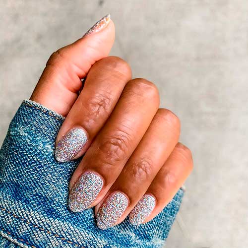 Perfect glitter nails done with EXCLAMATION POINT Silver Glitter Nail Polish by olive & June!