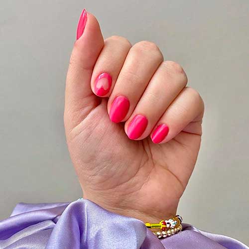 Perfect nails done with XOXO Hot Pink Nail Polish by Olive & June!