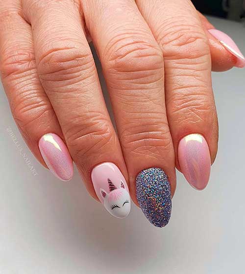 Baby pink unicorn nails with accent silver glitter nail, and a unicorn face on middle fingernail!