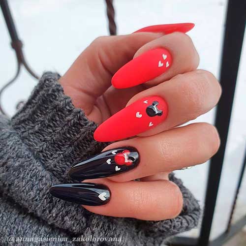 Cute almond shaped matte red and black nails with small white hearts design!
