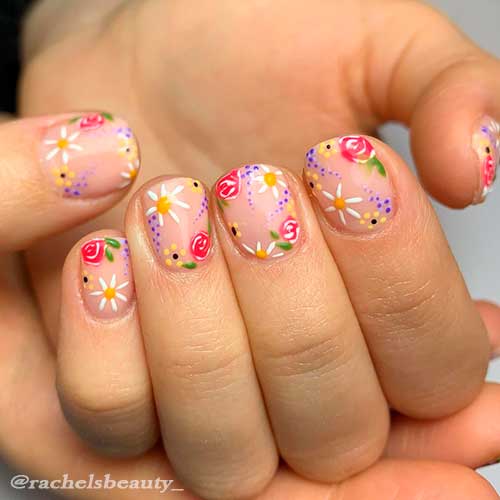 Cute short nails with floral nail art between white, red, and yellow spring florals for spring 2021!