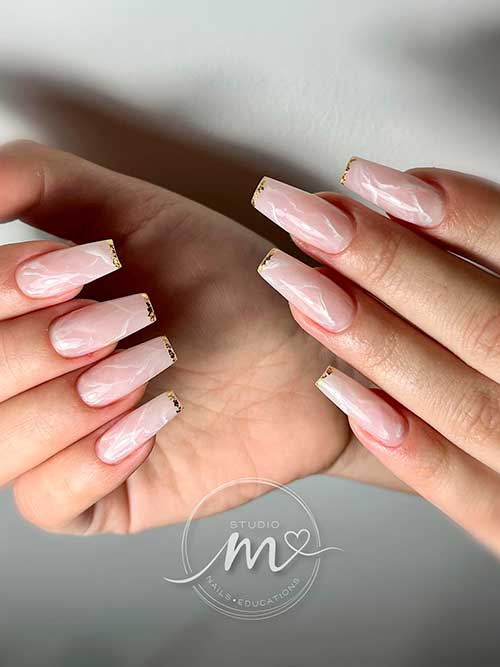 Long coffin pink marble nails with gold foil tips are suitable for a variety of occasions