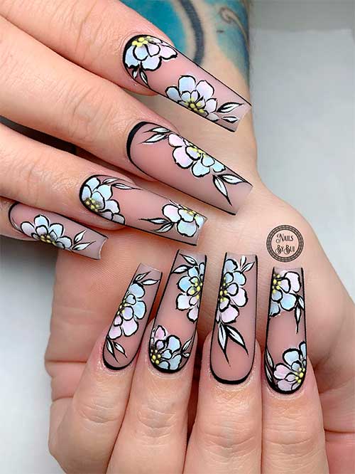 Long coffin transparent black spring nails 2023 with pastel-colored flowers and a bold black perimeter