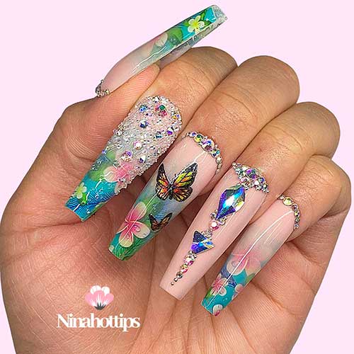 Coffin shaped butterfly nail art with nail blings and floral nail art for spring 2021 Coffin shaped butterfly nail art with nail blings and floral nail art for spring 2021
