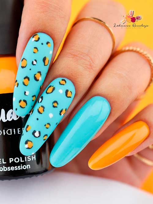 Long Round Shaped Baby Blue Nails with leopard Print Nail Art on Two Accent Nails and Orange Accent Nail