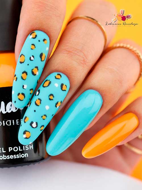 Baby Blue Nails with leopard Print Nail Art Long Round Shaped Baby Blue Nails with leopard Print Nail Art on Two Accent Nails and Orange Accent Nail