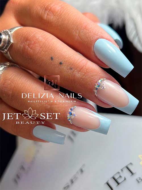 Classy long coffin light blue nails 2023 with two French accent nails adorned with rhinestones