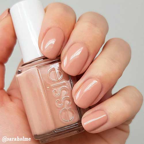 Cute short nude nails achieved with Essie nude nail polish The Snuggle is Real!