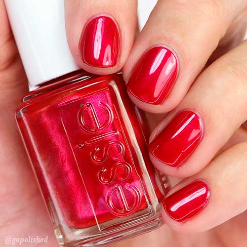 Cute short red nails achieved with Essie berry red nail polish Pjammin’ All Night!