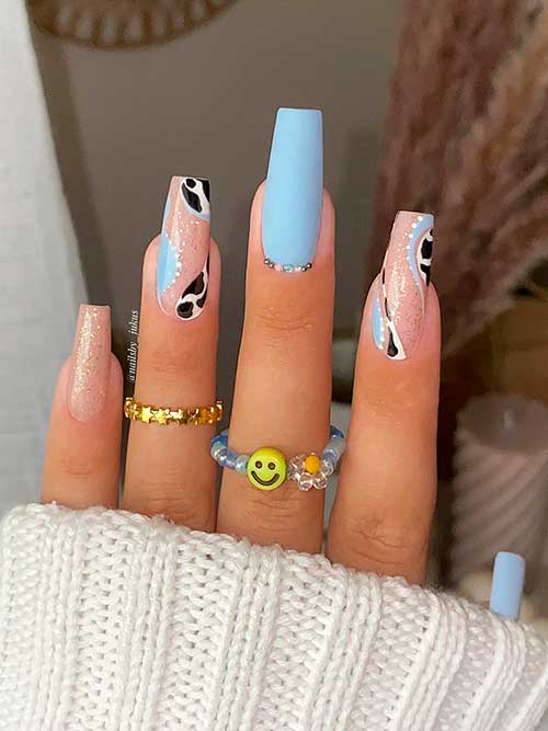 Long Coffin Shaped Matte Light Blue Nails with Gold Glitter, Swirls, and Cow Prints